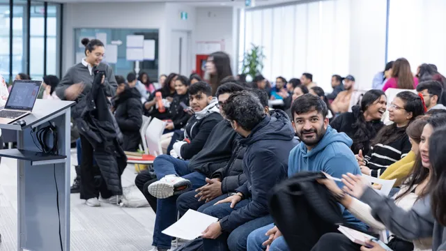 A full room of students and facilitators at an SLC Innovation Hub workshop.